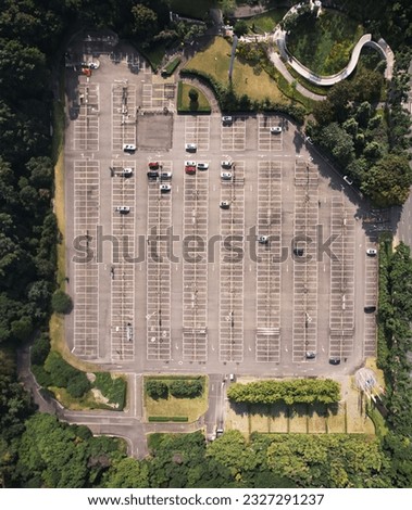 different car rows parked on finished auto warehouse area. High quality photo