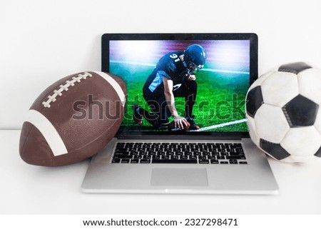 In action. Young man american football player at stadium in motion on glowing spotlights background. Action, activity, sportlife concept. Flyer for ad, design. Copyspace for ad.