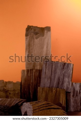 Background texture of cutted  small woods isolated in orange background, design for backdrop or photo product.