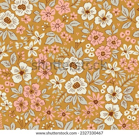 Vintage floral pattern in small abstract flowers. Small rose pink and white flowers. Gold background. Ditsy print. Floral seamless background. Liberty template for fashion prints. Stock pattern. Royalty-Free Stock Photo #2327330467