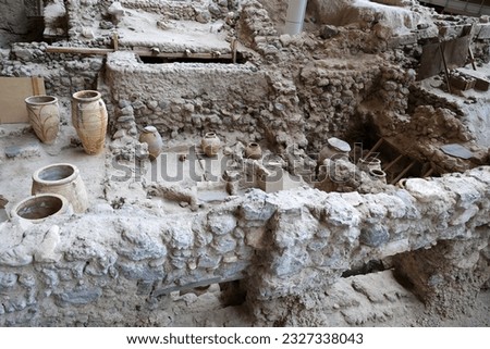 
Amphorae at the Akrotiri Archaeological Site on the Greek Cyclades island of Santorini-Greece
 Royalty-Free Stock Photo #2327338043