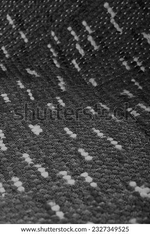 Seamless black and white carpet rug texture background from above, carpet material pattern texture flooring