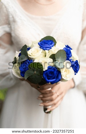 Bridal bouquet of roses for the wedding. Wedding accessories from natural flowers. Wedding day