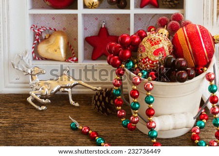 pot full of christmas retro decorations  on wooden table