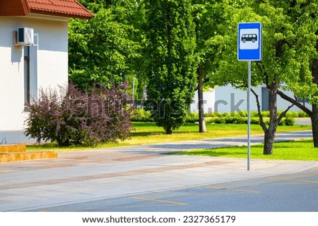 empty bus stop in a small town. bus stop sign. city bus stop