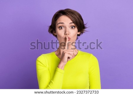 Photo of girl pouted lips finger muted no words information confidential information be quiet symbol isolated on violet color background