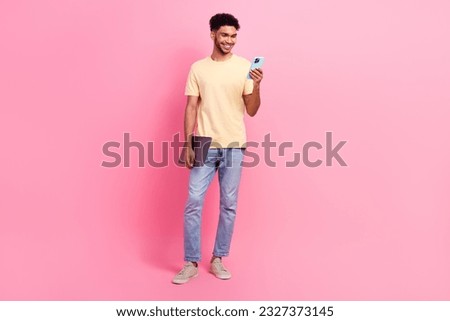 Full body size photo of young it specialist student guy intern using smartphone browsing new job website isolated on pink color background