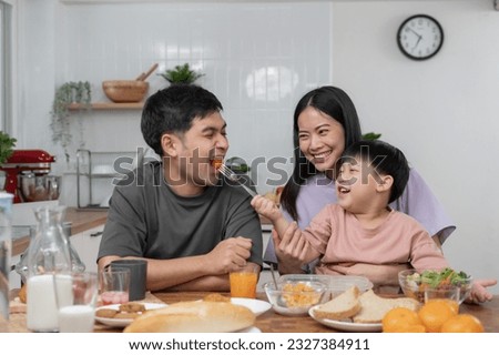 New home for family. activities together during the holidays. Parents and children are having activity on vacant time. weekend, enjoyment, happy family, togetherness, feel good. Move home