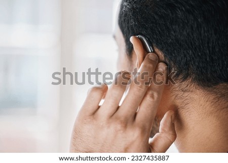 Hearing aid, face and ear of man with disability from the back on mockup space. Closeup of deaf person, medical device or implant of sound waves, audiology or help of listening equipment for wellness Royalty-Free Stock Photo #2327435887