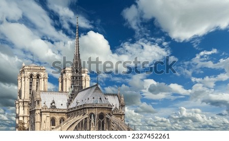 Notre Dame de Paris (against the background of sky with clouds), also known as Notre Dame Cathedral or simply Notre Dame, is a Gothic, Roman Catholic cathedral of Paris, France Royalty-Free Stock Photo #2327452261