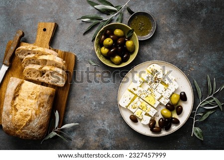 Feta cheese, olives and ciabatta, top view