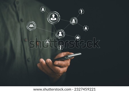Selecting the Best: A manager in the HR department uses a digital screen to assess candidates and make a strategic hiring decision. Leveraging technology for effective recruitment and HR management. Royalty-Free Stock Photo #2327459221