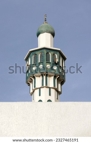 Minaret of the mosque against blue skies in Abu Dhabi, UAE. High quality photo.