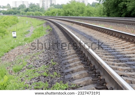 Close-up photo of rails and sleepers and gravel Royalty-Free Stock Photo #2327473191