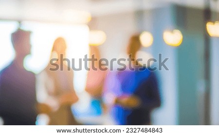 Defocused bokeh effect positive concept background of unrecognizable people diverse business team meeting of young professionals corporate startup Royalty-Free Stock Photo #2327484843