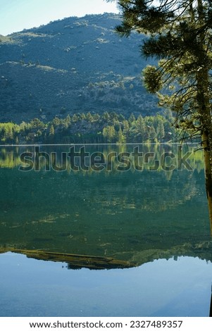 A peaceful moment at Silver Lake: A calm photo of the lake and hills in soft morning light
