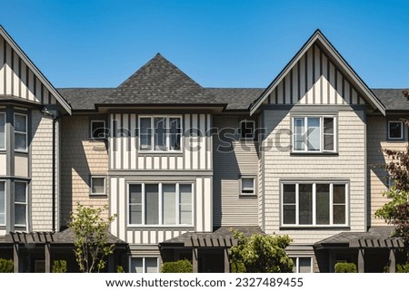 New residential townhouses. Modern apartment buildings in Surrey Canada. Modern complex of apartment buildings. Top of house. Concept of real estate development, house for sale and housing market Royalty-Free Stock Photo #2327489455