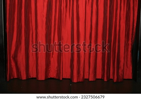 Red shiny satin stage curtain backdrop