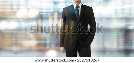 Handsome  businessman in swanky modern stylish suit plan graph growth and increase of chart positive indicators in his business