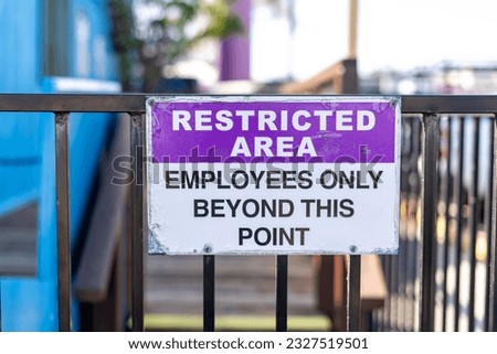 Restricted area employees only beyond this point sign