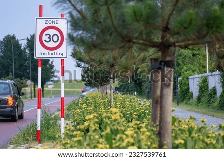 A traffic sign depicting a maximum speed limit of 30 kilometers per hour in Vlissingen, the Netherlands