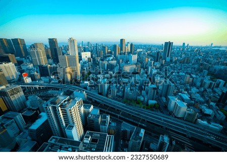 A dusk panorama cityscape near the railway in Osaka wide shot