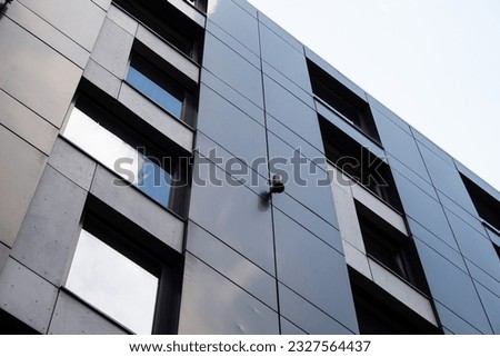 Close-up of Dark grey metallic panel facad. Modern architectural details. 