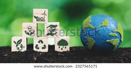 Earth model and eco concept wooden icons symbolizing green business utilizing bio power technology and environmental conservation for sustainable eco-friendly energy for clean future. Alter