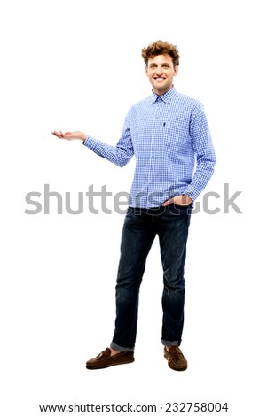 Full length portrait of a smiling man holding invisible product