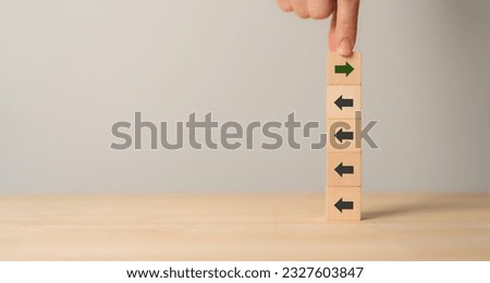 New ways of working, differentiation strategy concept  symbol on wood blocks. Providing uniqueness, different and distinct from competitors, creating competitive advantage. Business direction concept. Royalty-Free Stock Photo #2327603847