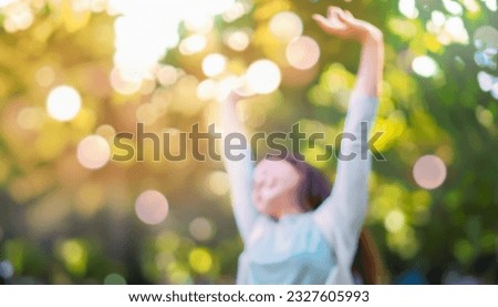 Defocused bokeh effect positive concept background of unrecognizable people enjoying healthy lifstyle exercising fitness outside