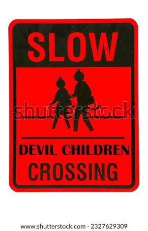 SLOW DEVIL CHILDREN CROSSING. Metal Caution sign. Slow Devil Children Crossing the street. Drivers worst nightmare. Parents Worst Nightmare. Traffic Sign. Red caution sign warning to drive slow. 
