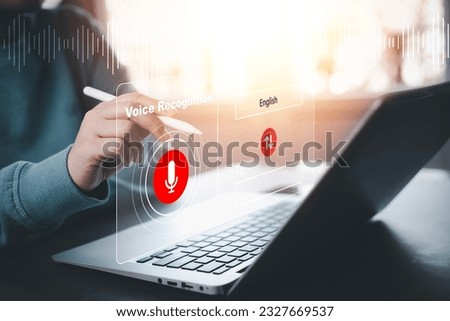 Businessman using laptop and touch microphone button on virtual screen. Blog blog speak talk advertising presentation,Voice recognition, speech detection and deep learning application,Voice Assistance