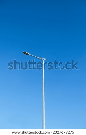 Street lamp post against a very clear blue sky on daylight. Royalty-Free Stock Photo #2327679275