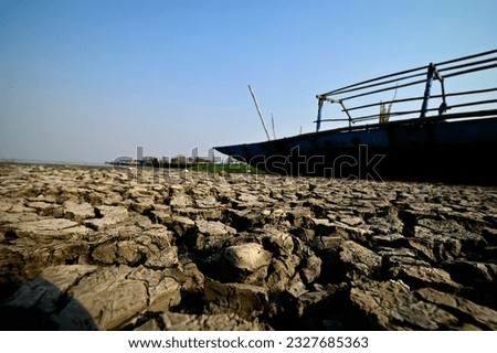Parched lake bed  of Lake Chilika in the summer, India. Royalty-Free Stock Photo #2327685363