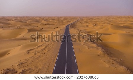 EL bnoud city To Timimoun city ; 340 km of Road surrounded by Beautiful Sand Dunes creating an amazing Sahara scape from the Algerian South west Royalty-Free Stock Photo #2327688065