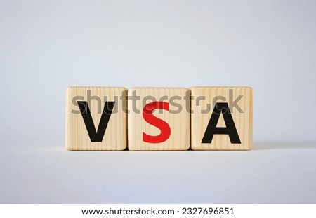 VSA - Volume Spread Analysis symbol. Wooden cubes with word VSA. Beautiful white background. Business and Volume Spread Analysis concept. Copy space.