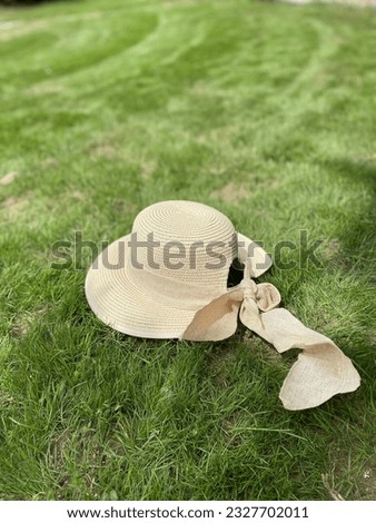 a hat in green grass on summer day