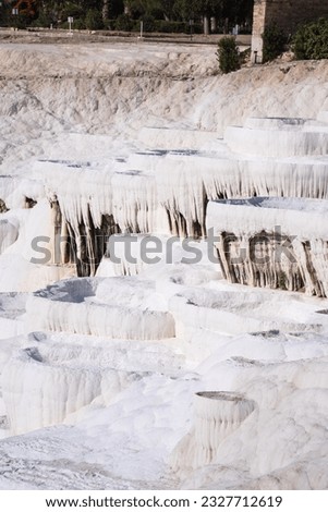 terraced baths in Pamukkale, formed from snow-white calcite stalactites