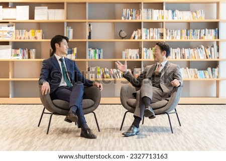 executive asian businessmen talking in a study room Royalty-Free Stock Photo #2327713163
