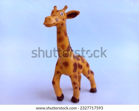 Giraffe toy isolated over white background (children's animal toy)