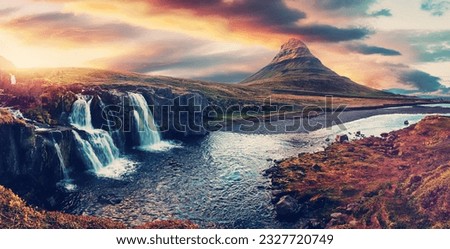 Amazing mountain landscape with colorful vivid sunset on the cloudy sky over the famous Kirkjufellsfoss Waterfall and Kirkjufell mountain. Iceland. popular location for landscape photographers. 
