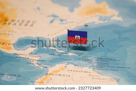 The Flag of Haiti on the World Map. Royalty-Free Stock Photo #2327723409