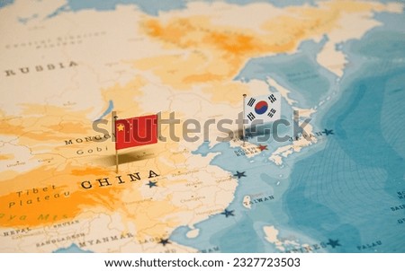 The Flag of China and Japan on the World Map.