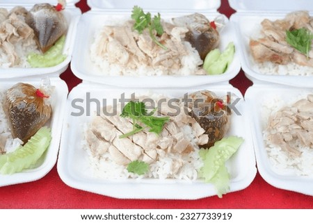 Chicken rice in a foam box.