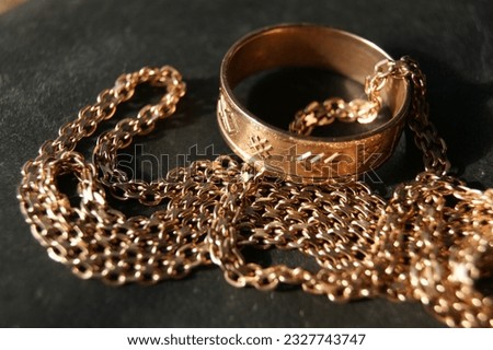 Gold ring and gold chain. Gold jewelry.