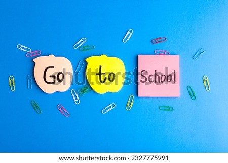 front view colored stickers with go to school writings on the blue background school color photo math