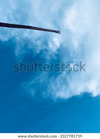 Hooks and a cloudy, partly cloudy sky