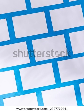 Vertical image of white business cards with copy space on blue background. Business, business card, stationery and writing space concept.