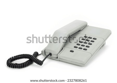 Grey vintage telephone from the eighties isolated on completely white background Royalty-Free Stock Photo #2327808261